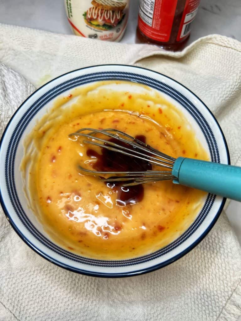 A touch of soy sauce added to a sweet chili sauce and kewpie mayo mixture.