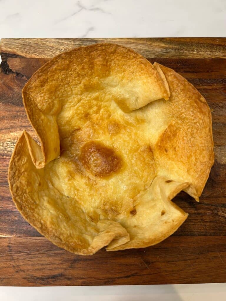 Top view of a baked tortilla to look like a taco bowl.