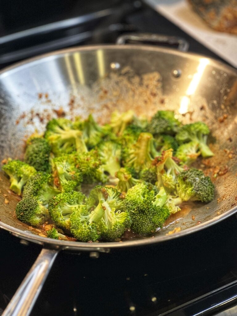 Cut broccoli in a wok.