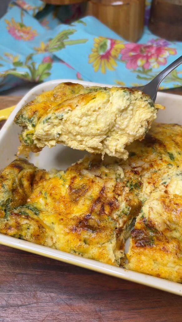 A spoonful of fluffy, cottage cheese baked eggs.