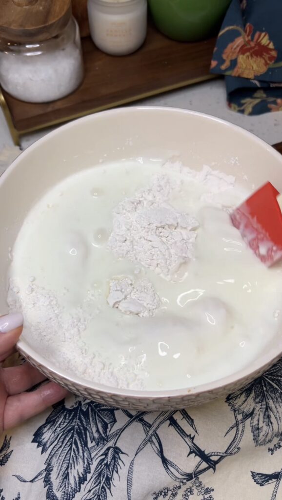 Buttermilk and flour in a bowl.