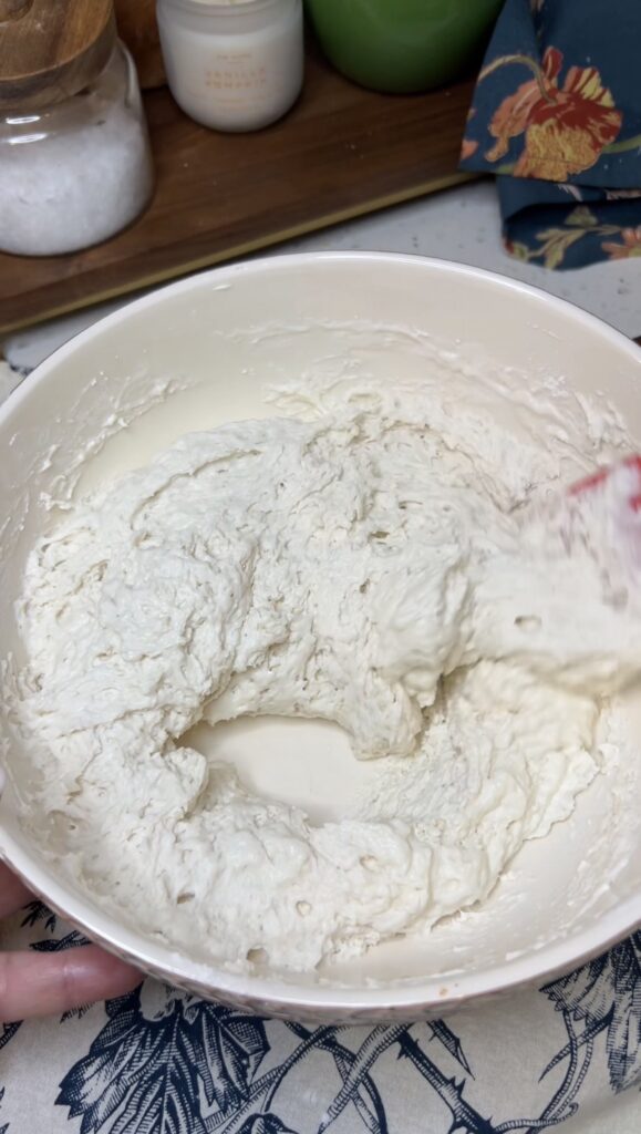 A bowl of swim butter biscuit dough in a bowl.