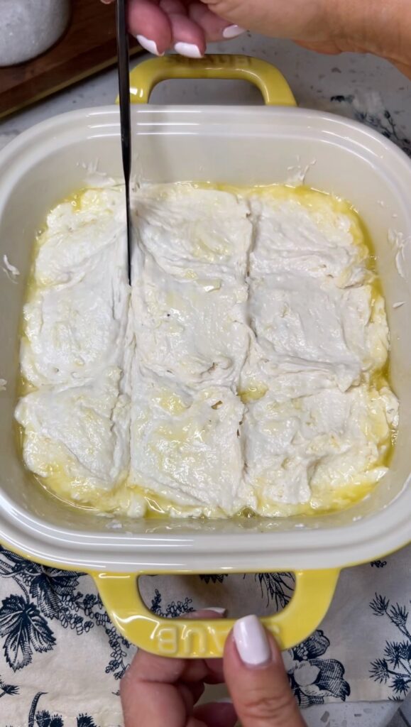 Scoring biscuit dough into nine biscuits.