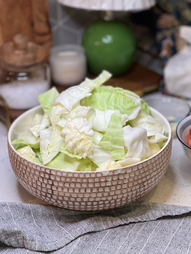 A bowl of large chunked green cabbage for Pork and Cabbage Stew