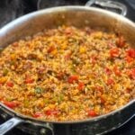 Ground Beef and Rice Skillet in a pan with bell peppers, ground beef and rice in a tomatoey sauce.