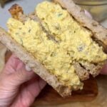Egg Salad with Bacon sandwich. The photo is showing the inside of two halves of the sandwich.