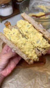 Egg Salad with Bacon sandwich. The photo is showing the inside of two halves of the sandwich.