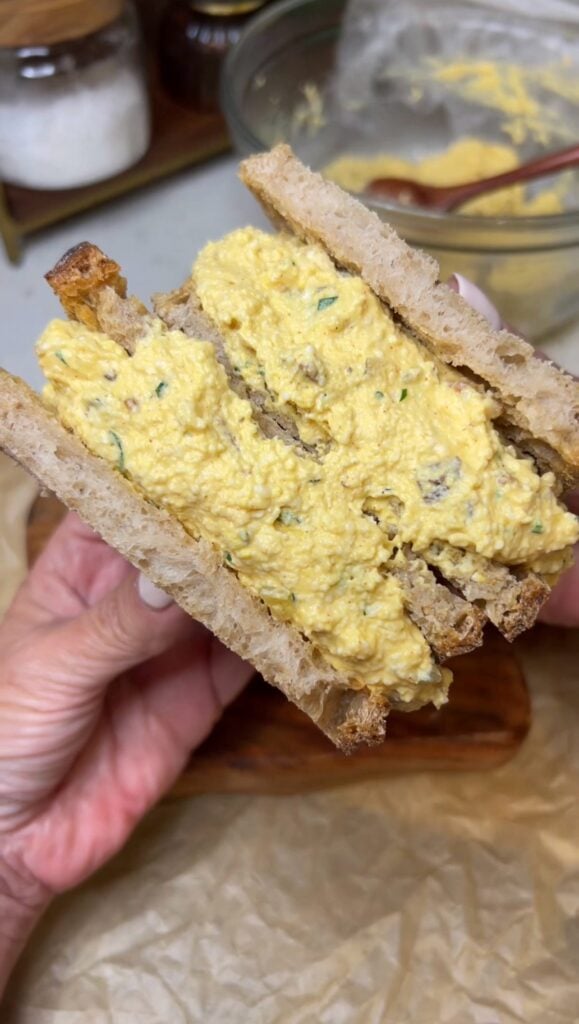 Egg Salad with Bacon sandwich. The photo is showing the inside of two halves of the sandwich.