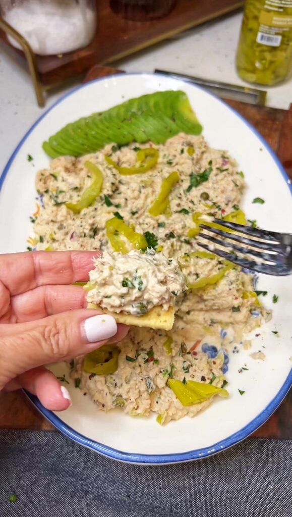 Tuna salad on a piece of cracker.